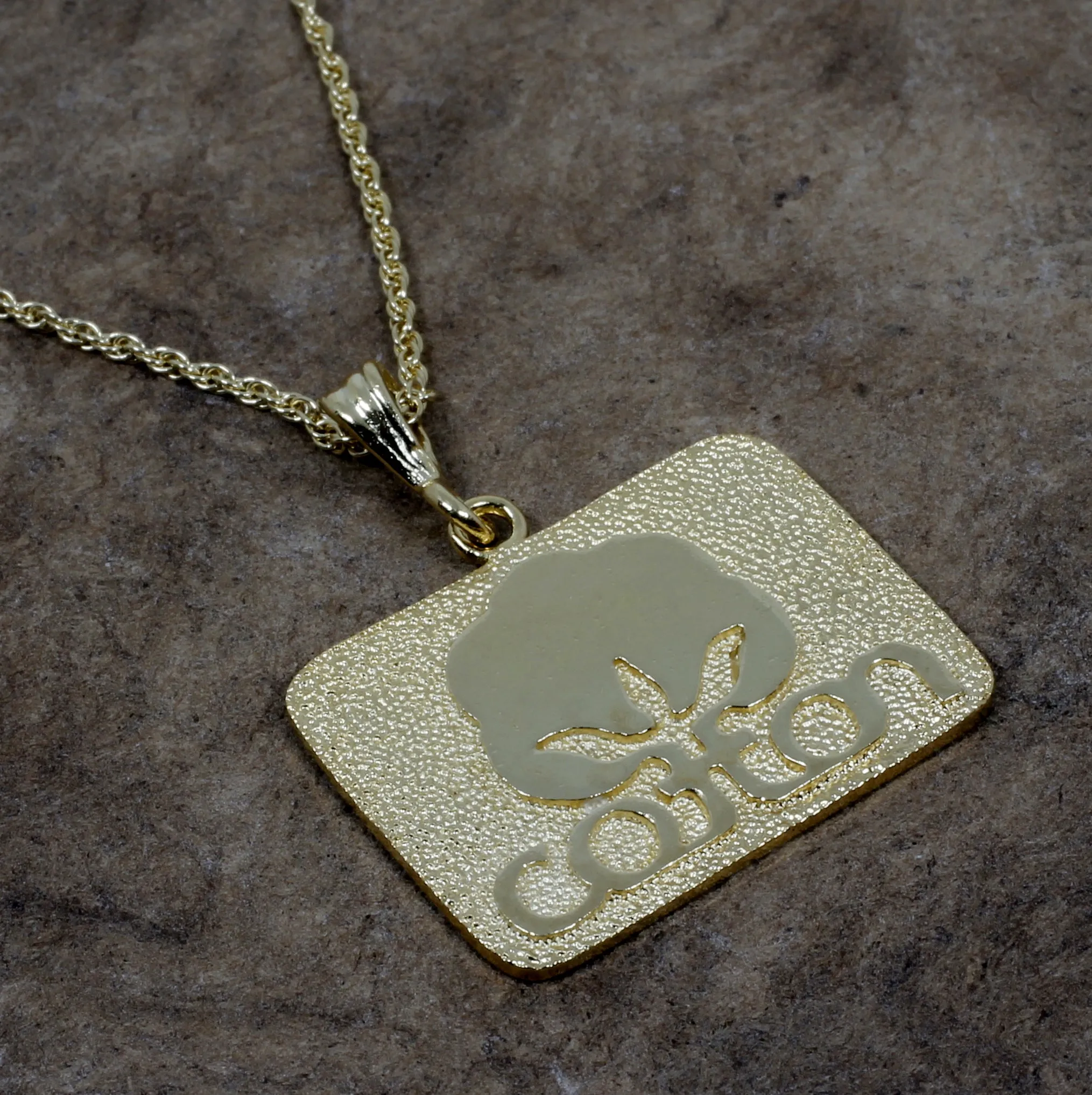 Large Gold Cotton Inc Necklace with Seal of Cotton Logo