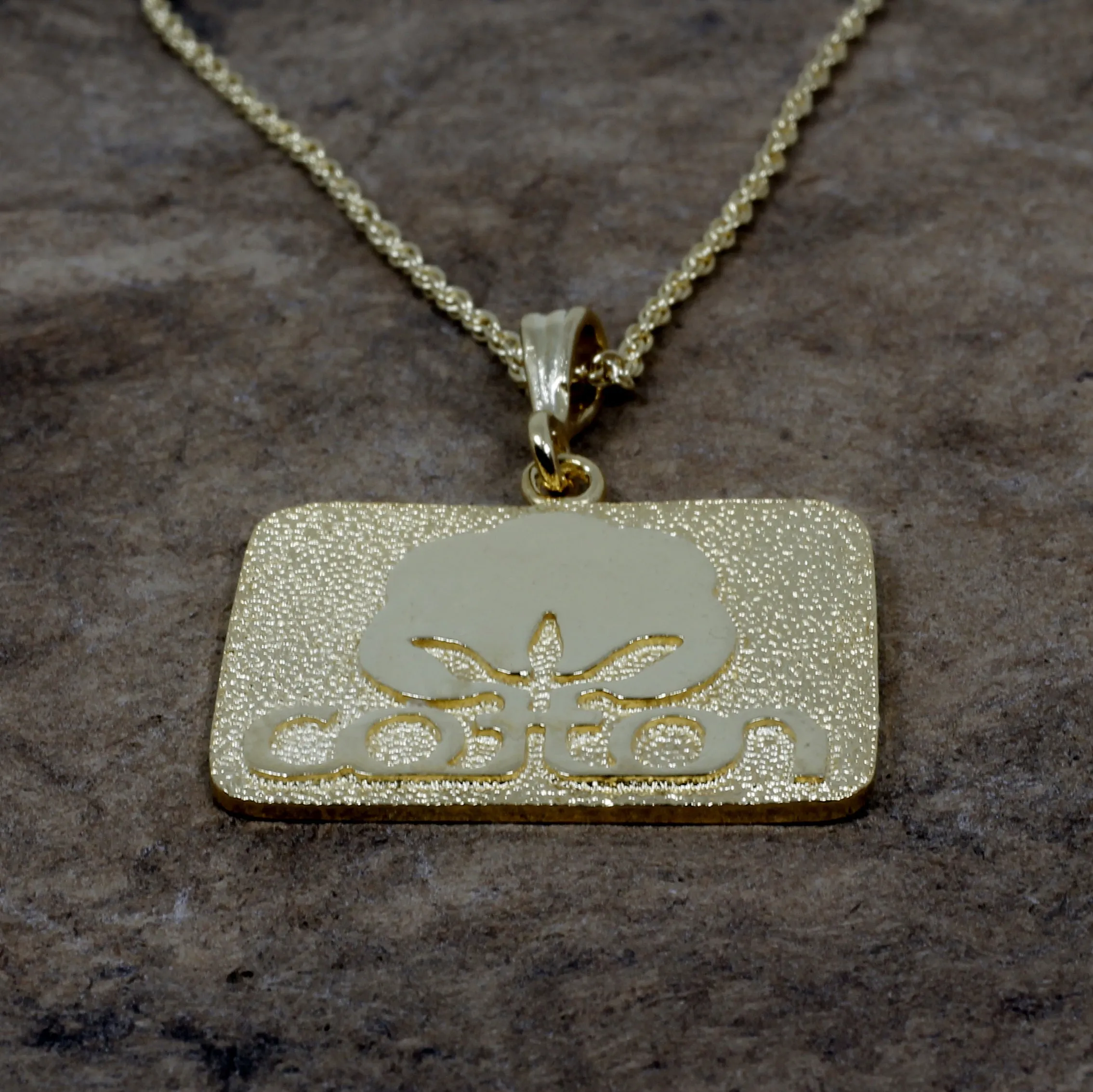 Large Gold Cotton Inc Necklace with Seal of Cotton Logo