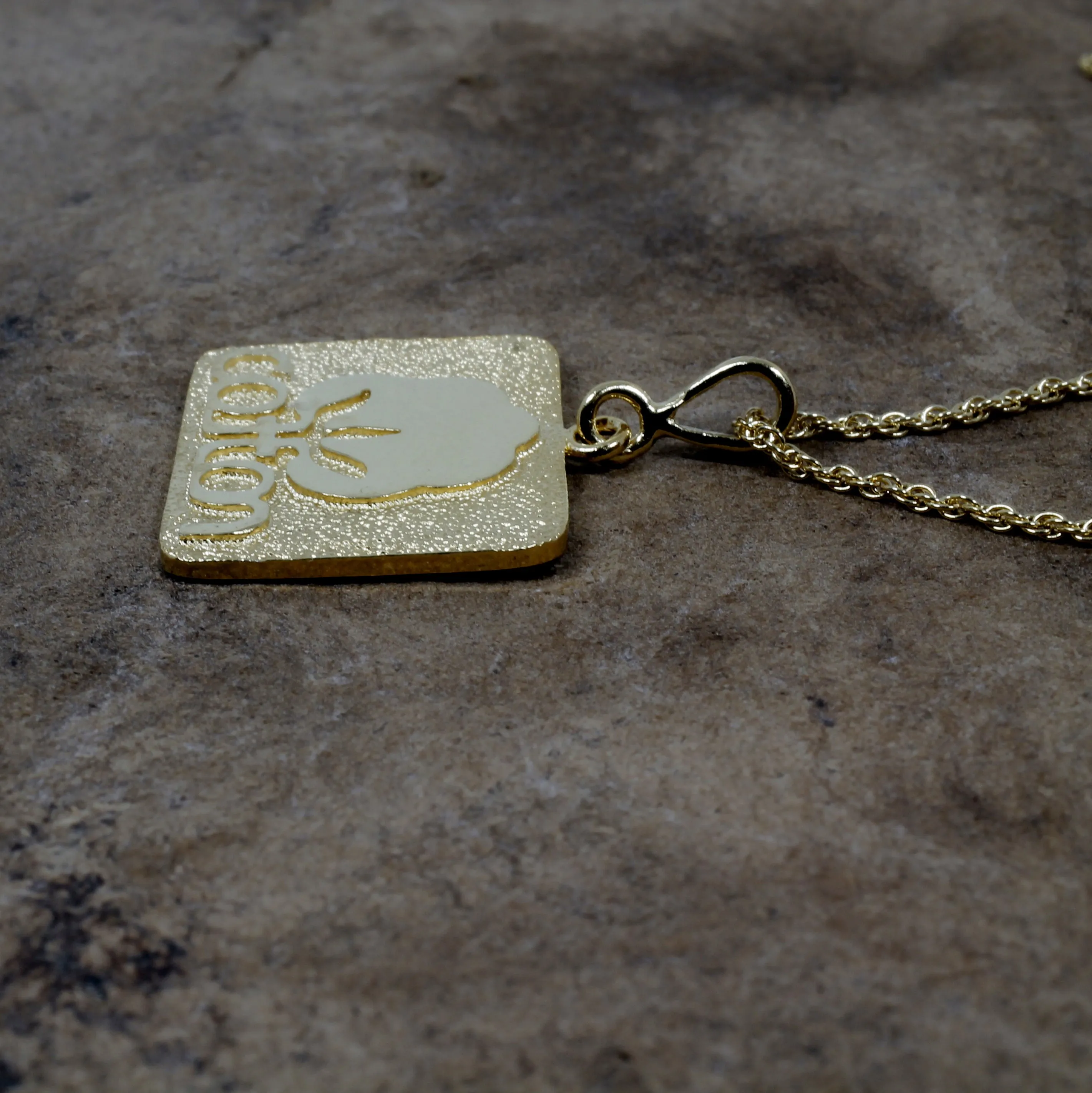 Large Gold Cotton Inc Necklace with Seal of Cotton Logo