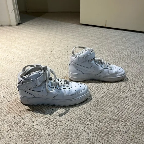 Nike Air Force 1 High Top Leather Sneakers.