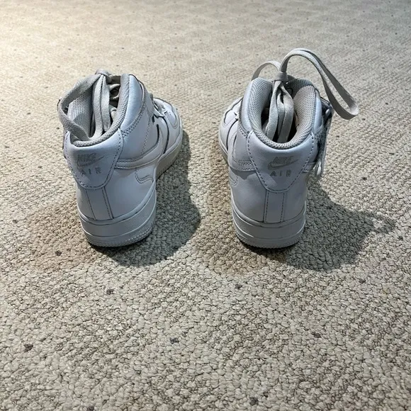 Nike Air Force 1 High Top Leather Sneakers.