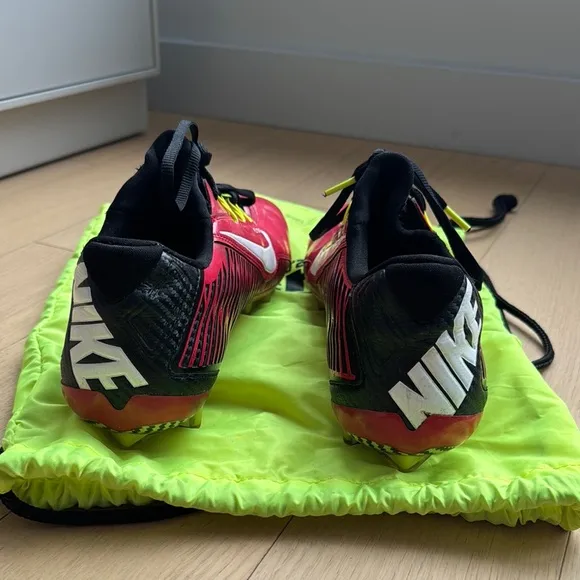 Red and Black Athletic Shoes with White Accents, carrying bag