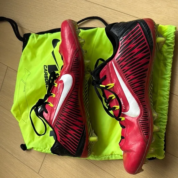 Red and Black Athletic Shoes with White Accents, carrying bag